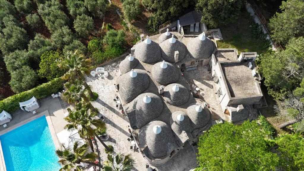 Villa Pesce trulli and pool seen from above in Fasano, Puglia